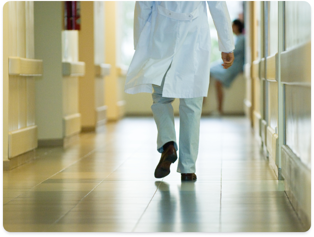 Physician walking down hall