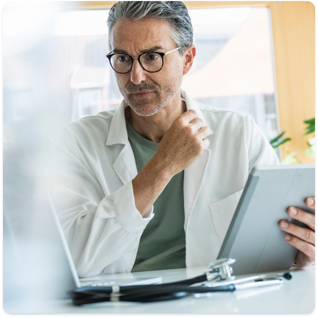 Physician holding tablet