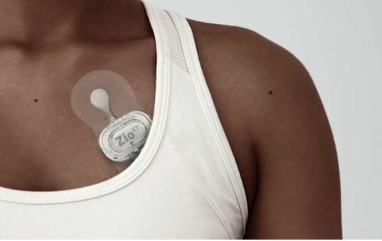 A person wearing the Zio XT heart monitor.