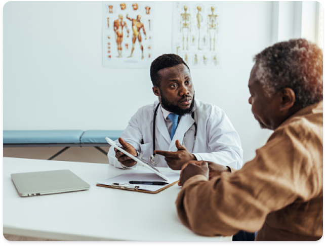 Physician showing information to patient 