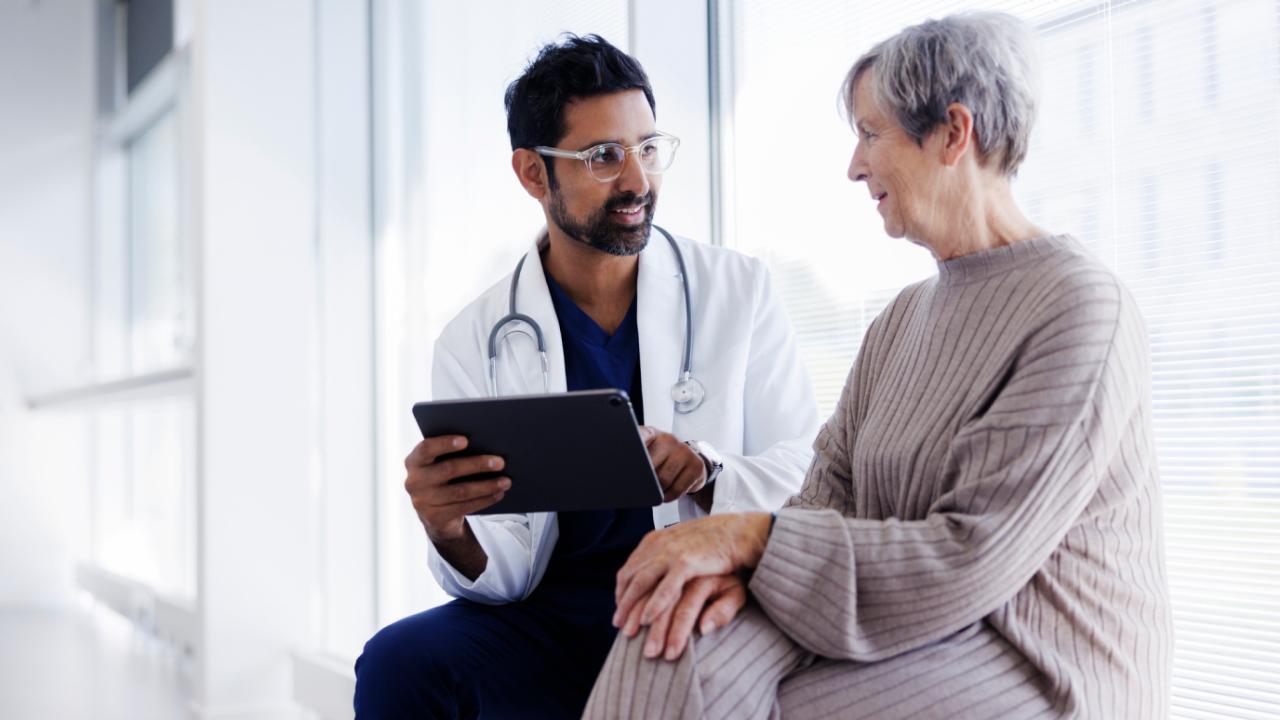 Physician talking with patient